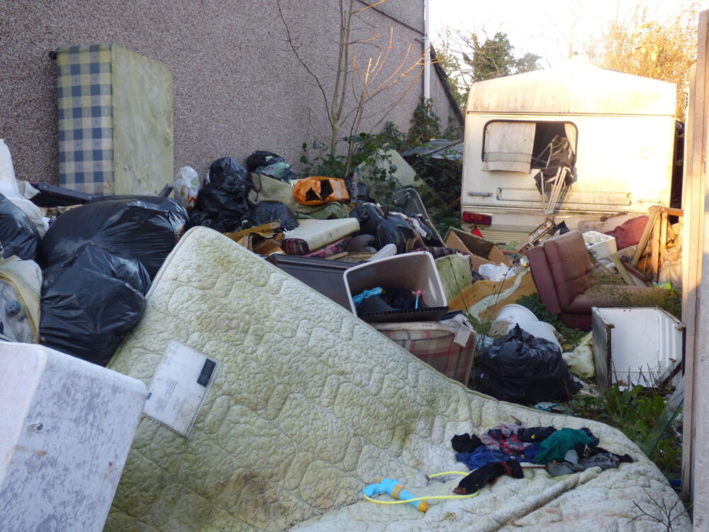 Council clears long-standing rubbish pile at vacant house